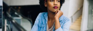 Young lady sitting thinking what the best job is for her
